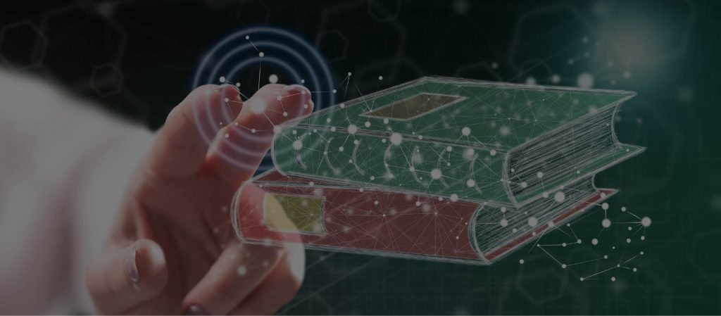 Finger som rör vid holografisk bok med digitala ljuspunkter – symbol för kunskap, teknik och framtidens lärande.